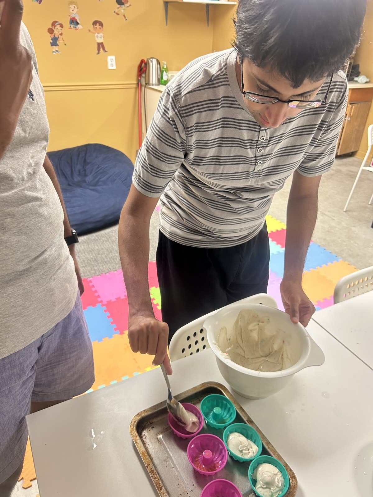 Spooning the batter - Jemasen Homecare participant